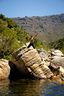 Taking a dive into one of Bains Kloof's fresh water pools.